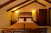 Bedroom with two single beds of a Deluxe Maisonette x 2-4 persons