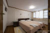 One of the two seperate bedrooms of the latge apartment