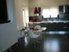 The luxurious seperate kitchen/living room with dining table of Biscotto apartment