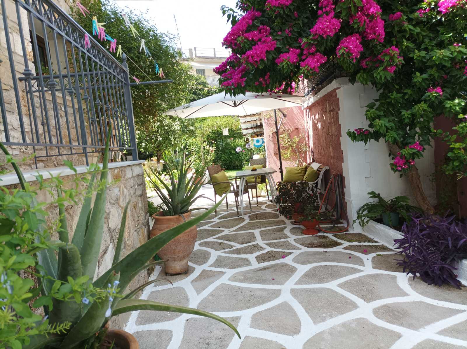 TABLES AND CHAIRS FOR GUESTS TO SIT AND ENJOY THE GARDEN